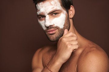 Manful guy with face mask posing on camera