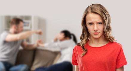 domestic violence, assault and social issue concept - unhappy teenage girl in red t-shirt over her mother and father having fight on background