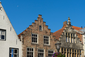 stepped gable houses against blue sky in Hulst, The Netherlands