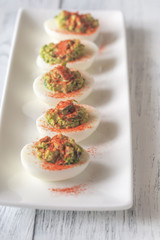 Guacamole and bacon deviled eggs