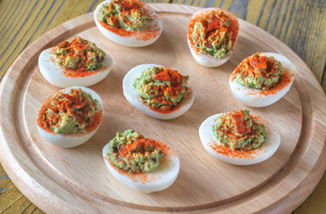 Guacamole and bacon deviled eggs