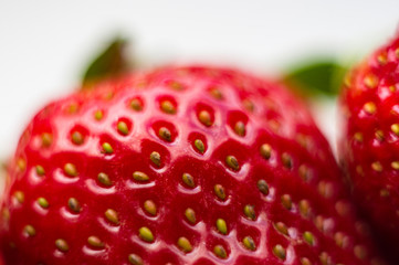 fresh ripe strawberries on black ceramic plate