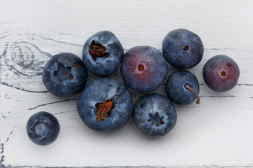 close up of blueberries on distressed white wood
