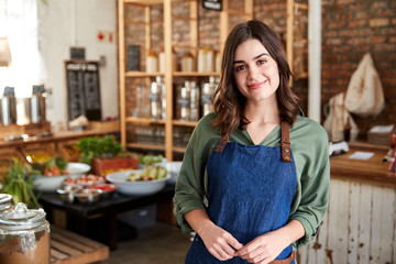 Portrait Of Female Owner Of Sustainable Plastic Free Grocery Store