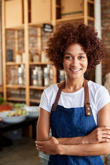 Portrait Of Female Owner Of Sustainable Plastic Free Grocery Store