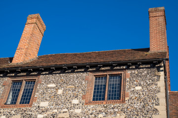 Stone flint house against a blue sky, Kent