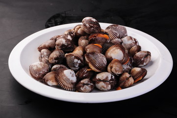 dried figs in a bowl on white background