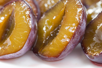 macro closeup of slice of juicy delicious ripe plum. fresh and frozen berries concept .