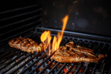 Beef Steak On Grill With Rosemary Pepper And Salt