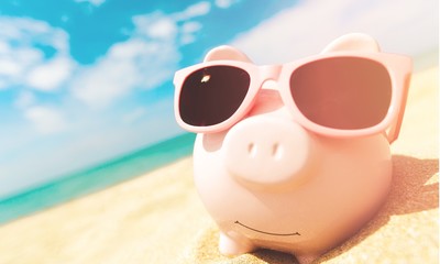 Piggy Bank Wearing Sunglasses Relaxing At The Beach