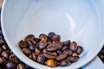 coffee beans in white coffee cup