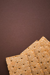 Crisp bread on the dark brown background