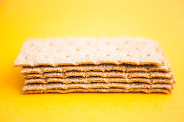 Crisp bread on the yellow background