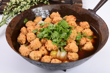 chicken with vegetables and rice in pan