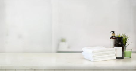 Towels and spa accessory on marble top table