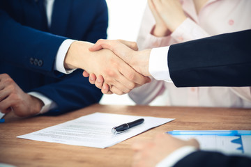 Business people shaking hands finishing up a meeting. Handshake at successful negotiation