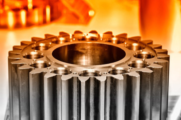 Industrial gear on light background. Red toned