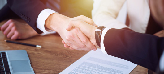 Business people shaking hands at meeting or negotiation in the office. Handshake concept. Partners are satisfied because signing contract