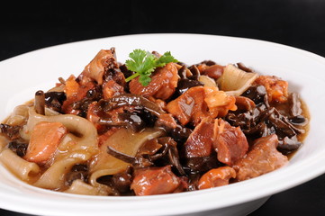 beef stew with mushrooms and vegetables on plate