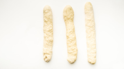 Step by step visual instructions of of braiding a challah bread