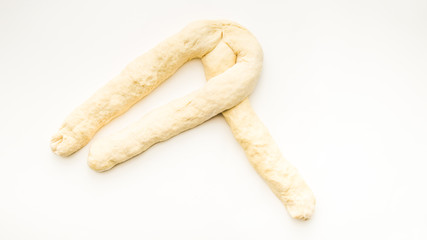 Step by step visual instructions of of braiding a challah bread