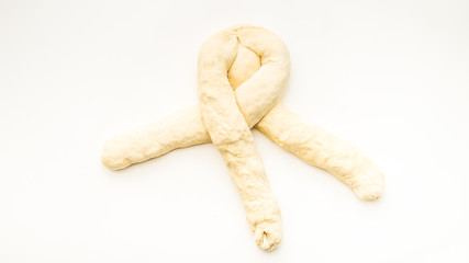 Step by step visual instructions of of braiding a challah bread
