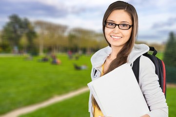 Fototapeta premium Young Female College Student on background