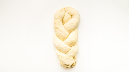 Step by step visual instructions of of braiding a challah bread