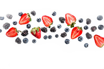 Fresh berries pattern - blueberries, strawberries, blackberries. On white background, top view, flatlay layout
