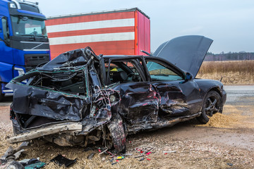 Car accident of three vehicles on a road in  car after a collision with a heavy truck, in Latvia