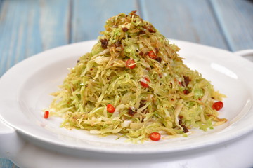 pasta with pesto sauce and basil