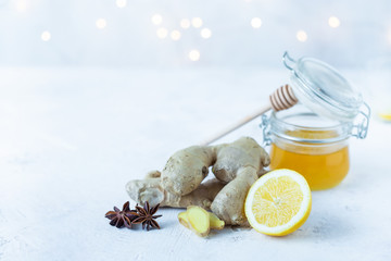 ginger root, lemon, honey, anise on a white background