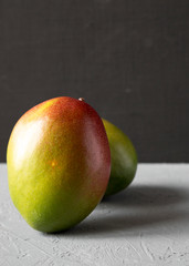 Colorful sweet mangoes, side view. Close-up.