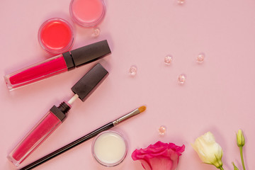 Obraz na płótnie Canvas Lip gloss and lip care balm, still life with different shades. Cosmetics