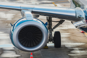 Wing and turbine of a airplane that landed at airport. 