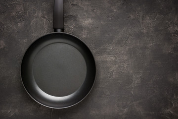 Empty Frying Pan Black on Dark Stone Surface. Culinary Background. - 260757490