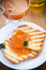 fried toast with apricot jam in a plate