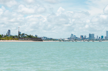 View of Praia de Tambau beach and the city on background at Joao Pessoa PB Brazil. Touristic beach of Brazilian northeast. View from the sea to the city.