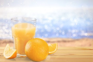 Orange juice and slices of orange on background