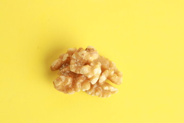 Peeled walnuts in colorful background