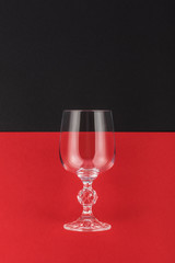 Wine glass on black and red background. Wine symbol