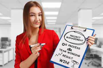 Business, technology, internet and networking concept. Young entrepreneur showing keyword: Project...