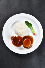 fried egg with tomato sauce on white plate