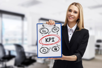 Business, technology, internet and networking concept. Young entrepreneur showing keyword: KPI