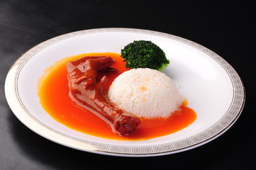 fried eggs with meat and vegetables