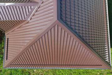 A view from above on the roof of the house. The roof of corrugated sheet. Roofing of metal profile wavy shape