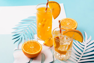 Orange juice in glass and fresh fruits