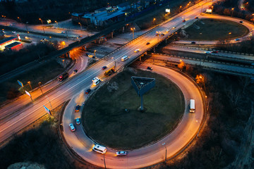 Aerial view of transport junction, asphalt city roads and Interchanges, top view from drone of...