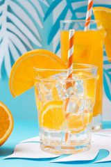 Orange juice in glass and fresh fruits