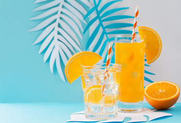 Orange juice in glass and fresh fruits